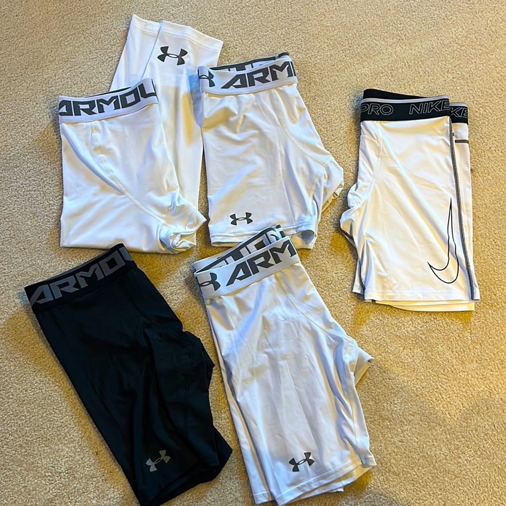 Four pair of men’s compression shorts xl and one pair of pants in xlt